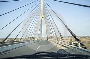 Driving car along the Guadiana International Bridge photo